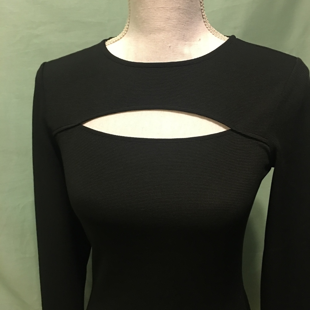 H&M dress. Black. Detail on neck. Size 6. Ribbing